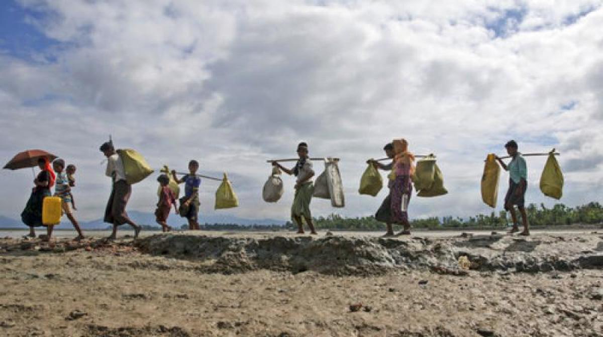 Bangladesh scuttles boats, jails captains to curb Rohingya influx